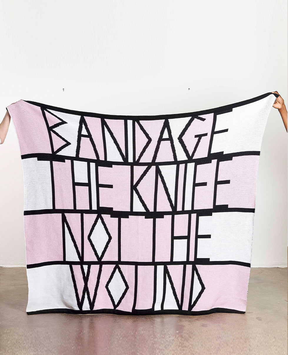 Limited edition of 50 artist blanket for sale. Broomberg & Chanarin Artist-Inspired Gift. People holding the blanket so full pattern is visible